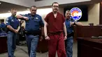 Terdakwa penembak di bioskop Colorado, James Holmes usai mengikuti sidang di Centennial, Colorado, Rabu (26/8/2015). James dijatuhi hukuman penjara seumur hidup tanpa pembebasan bersyarat atas pembunuhan 12 orang. (REUTERS/RJ Sangosti/Pool)