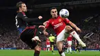 Pemain Manchester United, Sergio Reguilon (kanan) berebut bola dengan pemain FC Copenhagen, Peter Ankersen pada laga Grup A Liga Champions 2023/2024 di Old Trafford, Manchester, Inggris, 24 Oktober 2023. (AFP/Paul Ellis)