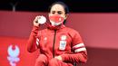 Atlet angkat berat putri Indonesia, Ni Nengah Widiasih berhasil meraih medali pertama bagi Kontingen Indonesia dalam ajang Paralimpiade Tokyo 2020 di Tokyo International Forum, Kamis (26/8/2021). Atlet asal Bali ini sukses meraih medali perak di kelas 41 kg putri. (Foto: Dok. NPC Indonesia)