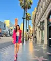 Outfit liburan pilihan Syifa Hadju juga tak kalah memesona. Ia mengenakan tank top putih, ditumpuk dengan oversized blazer berwarna pink tua yang serasi dengan heelsnya, dan mini skirt biru. [Foto: Instagram/syifahadju]
