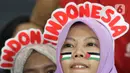 Suporter Timnas Indonesia memberikan dukungan dalam lanjutan Kualifikasi Piala Dunia 2026 melawan Filipina di Stadion Utama Gelora Bung Karno, Jakarta, Selasa (11/6/2024). (Liputan6.com/Herman Zakharia)