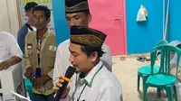 Ketua Kelompok Penyelenggara Pemungutan Suara (KPPS) TPS 19 Bandar Lampung, Abu Salim saat membacakan jumlah surat suara yang tercoblos. Foto : (Liputan6.com/Ardi)