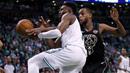 Pebasket Boston Celtics, Jaylen Brown, berebut bola dengan pebasket Milwaukee Bucks, Khris Middleton, pada gim kedua babak play off NBA di Stadion TD Garden, Rabu (18/4/2018). Celtics menang 120-106 atas Bucks. (AP/Charles Krupa)