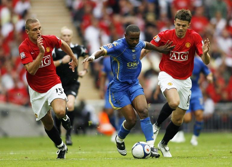 Nemanja Vidic ketika masih tampil bersama Michael Carrick pada Oktober 2008. (AFP/Glyn Kirk)
