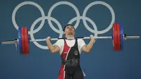 Eko membukukan angkatan Snatch 135 kilogram, tetapi tak berhasil mengangkat beban dalam tiga percobaan Clean & Jerk. (AP Photo/Kin Cheung)