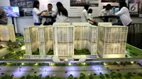 Sebuah maket plan tower apartemen dipamerkan pada pameran Indonesia Property Expo 2018 di JCC Jakarta, Senin (24/9). Dua anak usaha PT Adhi Karya (Persero) Tbk bersinergi membangun LRT City Green Avenue di Bekasi Timur. (Liputan6.com/Fery Pradolo)