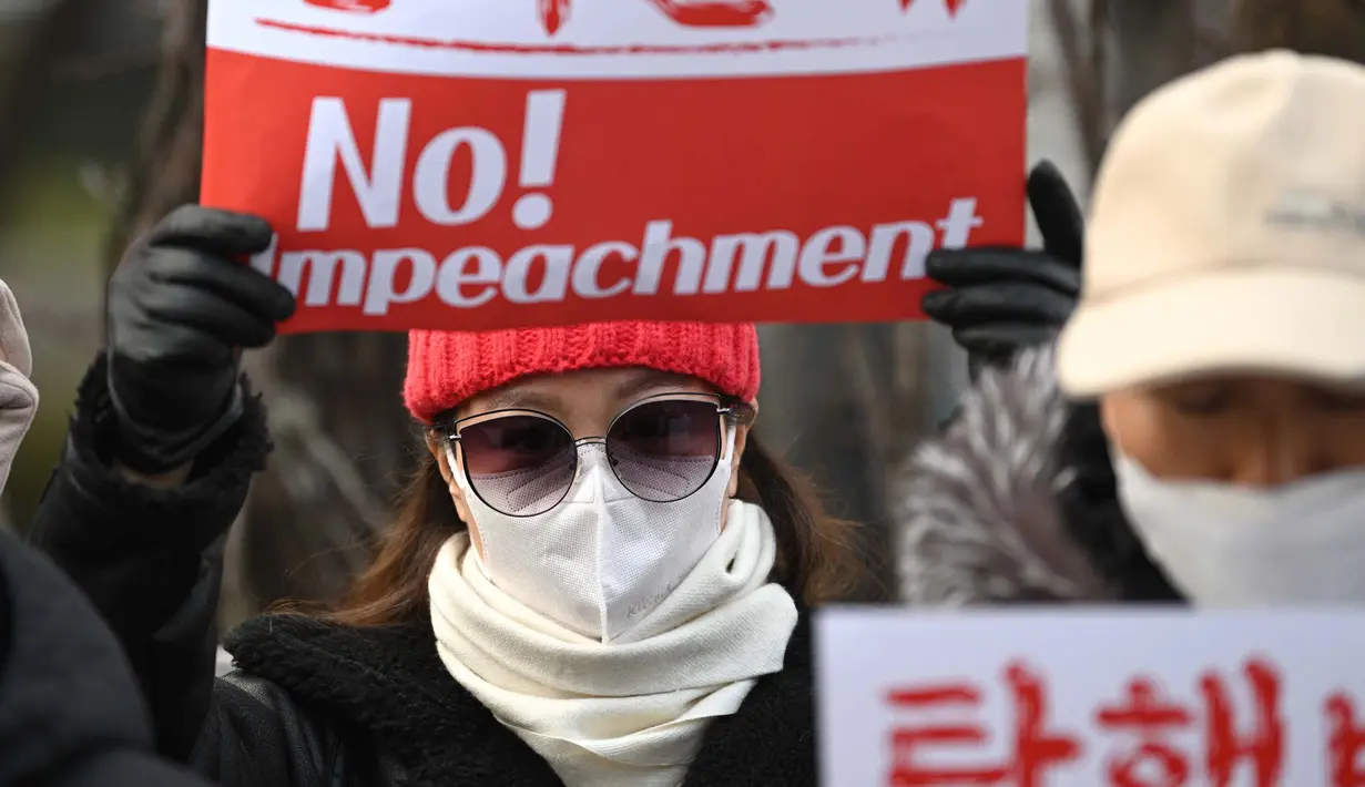 Mahkamah Konstitusi Korea Selatan menggelar sidang pemakzulan Presiden Yoon Suk Yeol atas upaya darurat militer yang gagal pada Selasa 14 Januari 2025. (Jung Yeon-je/AFP)