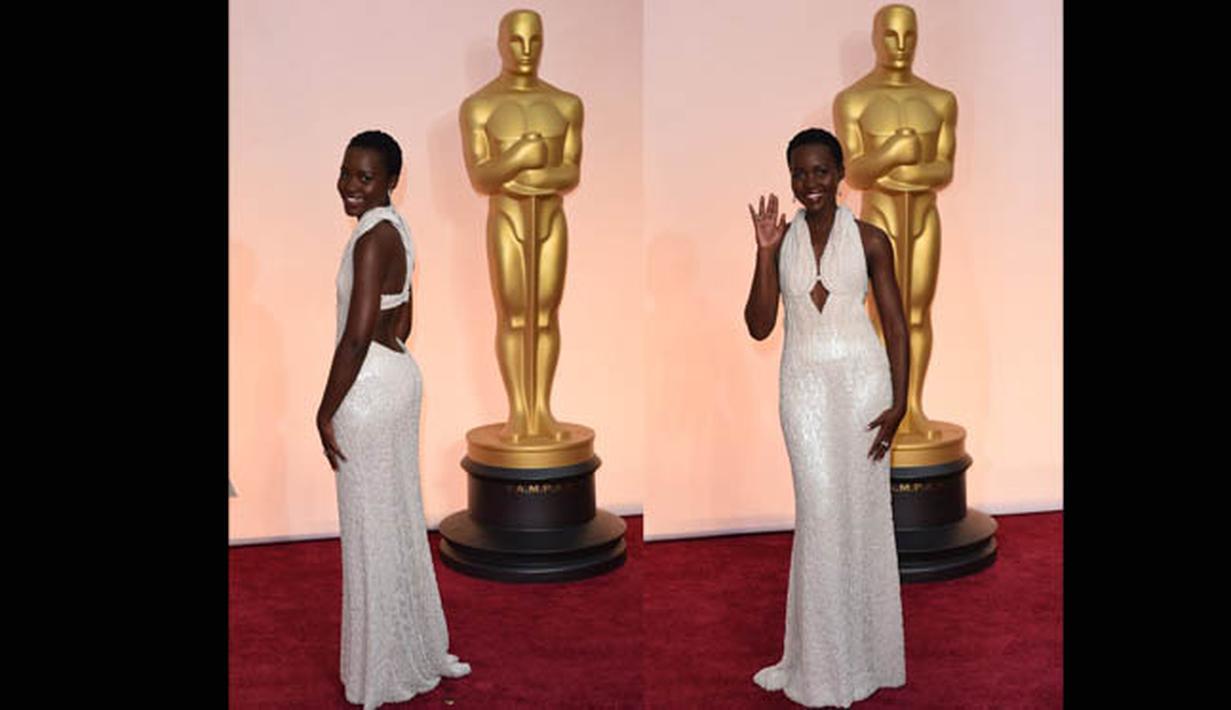 Lupita Nyong'o terlihat seksi dengan gaun potongan halter neck di Academy Awards 2015 yang digelar di Dolby Theatre, Hollywood, California, AS, Minggu (22/2) malam. (AFP PHOTO/ Mark RALSTON)