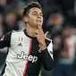 Penyerang Juventus, Paulo Dybala berselebrasi usai mencetak gol ke gawang Atletico Madrid pada pertandingan Grup D Liga Champions di stadion Allianz di Turin, Italia (26/11/2019). Juventus menang tipis atas Atletico Madrid 1-0. (AP Photo/Antonio Calanni)