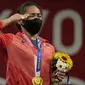 Sejak keikutsertaan Filipina di Olimpiade 1924, tepatnya 97 tahun yang lalu, akhirnya Filipina mampu meraih medali emas pertamanya di Olimpiade Tokyo 2020. Adalah Hidilyn Diaz, atlet angkat besi putri di kelas 55 kg yang mempersembahkannya, Senin (26/7/2021). (Foto: AP/Luca Bruno)