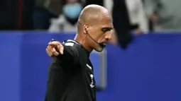 Pada menit ke-90+9 Timnas Indonesia malah kebobolan melalui Mohamed Marhoon mencetak gol setelah memanfaatkan situasi tendangan pojok. Skuad Garuda pun gagal meraih kemenangan perdananya dan laga berakhir dengan skor 2-2. (AFP/Hector Retamal)