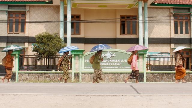 Masyarakat adat dan penganut Islam Kejawen di Kalikudi, Kecamatan Adipala, Kabupaten Cilacap, menggelar tradisi Pudunan.  (Foto: Liputan6.com/Muhamad Ridlo)