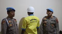 Brigadir Polisi TGP&nbsp;menjalani proses hukum internal di Polresta Pati pada Sabtu (16/8/2025). (Liputan6.com/ Arief Pramono)