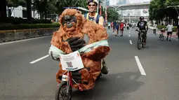 Aksi tersebut untuk memperingati Hari Orangutan Sedunia 2025 dalam mendukung perlindungan dan pelestarian populasi satwa langka itu beserta habitatnya. (YASUYOSHI CHIBA/AFP)
