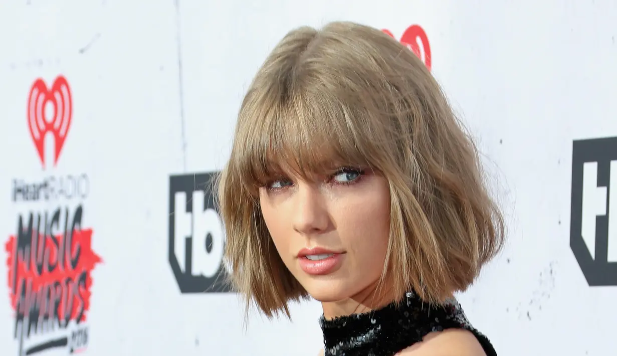 Kini, Taylor Swift masih menjadi pusat perhatian publik tentang hubungan asmaranya dengan aktor tampan asal Inggris, Tom Hiddleston. (AFP/Bintang.com)