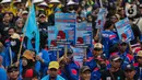 Buruh dari berbagai aliansi melakukan aksi damai dalam rangka peringatan May Day atau Hari Buruh Internasional di kawasan Patung Kuda, Jakarta, Rabu (1/5/2024). (Liputan6.com/Angga Yuniar)