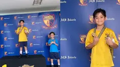 Raffi Ahmad dan Nagita Slavina dibuat bangga dengan berhasil menjadi juara 1 lomba renang. Rafathar dengan hebatnya berdiri di podium sebagai juara 1. Ia tersenyum sambil memegangi medali yang berhasil ia dapatkan dari kerja keras lomba renang. (Liputan6.com/IG/raffinagita1717)