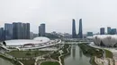 Foto udara pada 1 April 2022 ini menunjukkan Stadion Pusat Olahraga Olimpiade Hangzhou (kanan) dan Pusat Olahraga Pusat Olimpiade Hangzhou (kiri), tempat penyelenggaraan Asian Games ke-19, di Hangzhou di provinsi Zhejiang timur China. (STR / AFP)