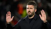 Pelatih asal Inggris untuk Manchester United, Michael Carrick, menunjukkan reaksi setelah mengalami kekalahan dalam pertandingan Liga Champions UEFA—laga ketiga League Phase—antara Como 1907 dan Manchester United di Stadio Giuseppe Sinigaglia, Como, Italia bagian utara, pada 21 Oktober 2026. (PIERO CRUCIATTI/AFP)