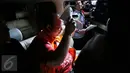 Andri Tristianto Sutrisna saat berada di dalam mobil tahanan usai menjalani pemeriksaan KPK, Jakarta, Minggu (14/2/2016). Andri ditetapkan tersangka terkait kasus dugaan suap permintaan penundaan kasasi sebuah perkara di MA. (Liputan6.com/Faizal Fanani)