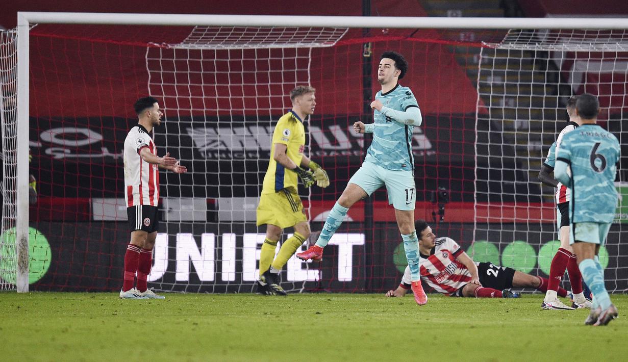 Pemain Liverpool, Curtis Jones, melakukan selebrasi usai mencetak gol ke gawang Sheffield United pada laga Liga Inggris di Stadion Bramall Lane, Minggu (28/2/2021). Liverpool menang dengan skor 2-0. (Oli Scarff, Pool via AP)