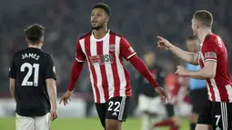 Penyerang Sheffield United, Lys Mousset berselebrasi usai mencetak gol ke gawang Manchester United pada pertandingan lanjutan Liga Inggris di Stadion Bramall Lane (24/11/2019). MU bermain imbang 3-3 atas Sheffield Unite. (AP Photo/Jon Super)