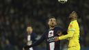 Gelandang Paris Saint-Germain atau PSG, Fabian Ruiz berebut bola dengan bek Nantes, Jean-Charles Castelletto pada pekan ke-26 Ligue 1 atau Liga Prancis 2022-2023 di Parc des Princes, Minggu (5/3/2023) dini hari WIB. Berkat hasil ini PSG kian kokoh di puncak klasemen Ligue 1 dengan raihan 63 poin. (AP Photo/Aurelien Morissard)