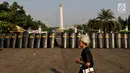 Tameng polisi terlihat saat aksi Kamisan ke-589 di depan Istana Merdeka, Jakarta, Kamis (20/6/2019). Dalam aksinya, JSKK meminta Presiden Joko Widodo juga menghapus impunitas sebagaimana tercantum dalam Nawacita. (Liputan6.com/Johan Tallo)