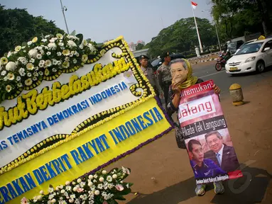 Sejumlah massa dari Kontras menggelar aksi damai di depan Istana Negara, Jakarta, (29/9/14). (Liputan6.com/Faizal Fanani)