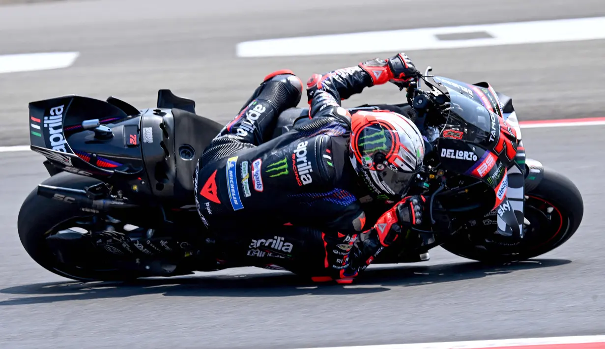 Pembalap Aprilia Racing asal Italia, Marco Bezzecchi, memenangkan race Pertamina Grand Prix MotoGP Indonesia di Sirkuit Internasional Mandalika, Mandalika, Sabtu (11/10/2026). (SONNY TUMBELAKA/AFP)