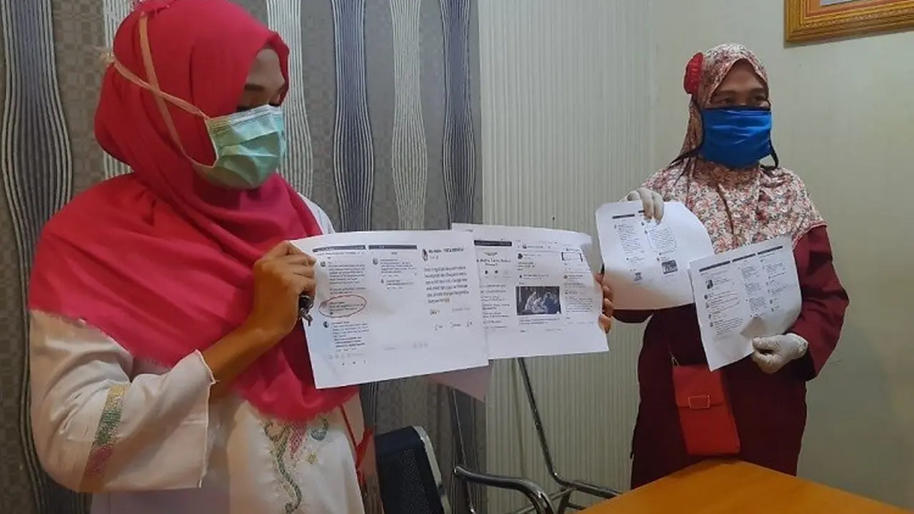 Sejumlah petugas medis melaporkan akun-akun Facebook yang diduga menyudutkan dan memfitnah ke Polda Gorontalo. (Foto: Liputan6.com/Arfandi Ibrahim)