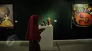 Pengunjung berjalan di Pameran seni rupa nusantara 2015 di Galeri Nasional, Jakarta, Kamis (28/05/2015). Sebanyak 106 karya 2 dan 3 dimensional diantaranya lukisan, drawing, object, seni grafis, video art,dll. (Liputan6.com/Andrian M Tunay)