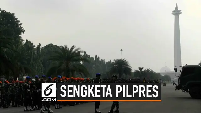 Ribuang personel bersiaga di kawasan Monas Jakarta Pusat. Mereka mengantisipasi pendemo yang akan mendatangi MK saat sidang sengketa Pilpres. Polisi juga mulai mengalihkan lalu lintas yang menuju jalan Merdeka Barat.