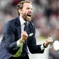 Pelatih Timnas Inggris, Gareth Southgate, meluapkan kebahagiaan usai membawa anak asuhnya mengalahkan Denmark pada laga semifinal Euro 2020 di Stadion Wembley, Kamis (8/7/2021). (Foto:AFP/Frank Augstein,Pool)
