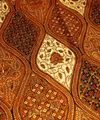 Batik Sogan dari Solo. Motif batik ini didominasi warna cokelat, memiliki motif bunga dengan aksen titik dan garis lengkung. Dulu, batik ini dipakai oleh para raja Jawa, khususnya dari Keraton Kesultanan Solo.