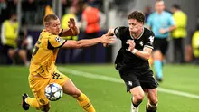Duel Kenan Yildiz dan Julian Ryerson dalam laga&nbsp;Juventus vs Borussia Dortmund di Liga Champions 2025/2026, Rabu (17/9/2025). (La Presse via AP Photo/Marco Alpozzi)