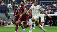 Penyerang Real Madrid, Kylian Mbappe, saat tampil dalam duel melawan&nbsp;Real Valladolid pada laga pekan kedua La Liga di Santiago Bernabeu, Minggu (25/8/2024) malam WIB. Dalam duel itu, Madrid menang 3-0 atas Valladolid. (AFP/Pierre-Philippe MARCOU)