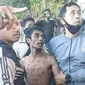 Foto: Andreas Pati Jumat, pelaku pembunuhan anak kandung saat dibekuk aparat Polres Flotim (Liputan6.com/Ola Keda)