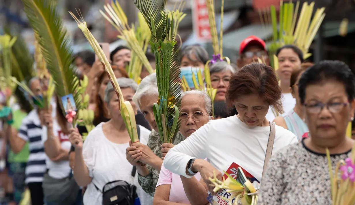 Minggu Palma menjadi bagian tak terpisahkan dari Pekan Suci yang mempersiapkan umat Kristiani untuk perayaan Paskah, kebangkitan Yesus Kristus. (Ted ALJIBE/AFP)