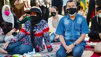 Gubernur Riau Syamsuar dan istri sebelum dirawat dan menjadi pasien Covid-19 di Riau. (Liputan6.com/Diskominfotik Riau)