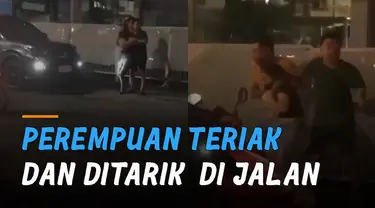 Beredar video seorang perempuan teriak-teriak di pinggir jalan dan ada dua orang pria disampingnya.