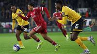 Winger muda Liverpool, Rio Ngumoha, tampl impresif ketika timnya meraih kemenangan 3-1 atas Wolverhampton Wanderers pada laga putaran kelima Piala FA di Molineux Stadium, Sabtu (07/03/2026) dini hari WIB. (AFP/Darren Staples)
