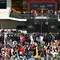 Penonton dan penggemar bersorak saat menyaksikan upacara podium kemenangan Grand Prix Formula 1 Amerika Serikat di Circuit of the Americas di Austin, Texas, pada 20 Oktober 2024. (ANGELA WEISS/AFP)