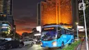 Bus TransJabodetabek saat melintasi kawasan jalan MH Thamrin, Jakarta, Selasa (27/5/2025). (Liputan6.com/Angga Yuniar)