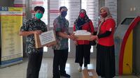 Telkomsel dan Startup Lulusan The NextDev Gandeng Penjahit Lokal Produksi Masker dan APD. Kredit: Telkomsel