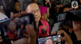 Mantan Menteri Perdagangan, Thomas Trikasih Lembong saat dibawa menuju mobil tahanan usai menjalani pemeriksaan di gedung Kejaksaan Agung, Jakarta, Selasa (29/10/2024). (Liputan6.com/Herman Zakharia)