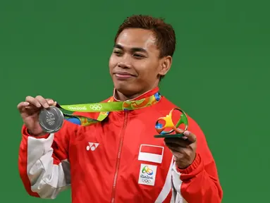 Indonesia meraih medali kedua di ajang Olimpiade Rio de Janeiro 2016 setelah lifter Eko Yuli Irawan menyabet medali perak di cabang angkat besi kelas 62 kg, Selasa (9/8/2016) pagi WIB. (AFP/Goh Chai Hin)