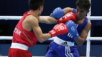 FINAL - Dua petinju Indonesia yakni Kornelis Kwangu Langu yang turun di kelas terbang 46-49 kilogram putra, dan Christina Marwan Jembay yang bertarung di kelas kelas bulu 57 kilogram putri berhasil lolos ke final SEA Games 2015. (Bola.com/Arief bagus)
