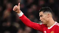 Ekspresi bintang Manchester United, Cristiano Ronaldo, saat menghadapi Brighton pada lanjutan Liga Inggris 2021/2022 di Stadion Old Trafford, Rabu (16/2/2022) dini hari WIB. (AFP/Paul Ellis)