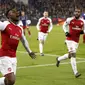 Ekspresi pemain Arsenal, Danny Welbeck usai membobol gawang CSKA Moscow pada leg kedua Liga Europa di CSKA Arena, Russia, (12/3/2018). Arsenal lolos ke Semifinal dengan agregat gol 6-3. (AP/Pavel Golovkin)